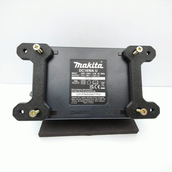 Wall Mount Brackets attached with screws to the back of Makita DC18WA Charger